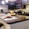a kitchen with black cabinets