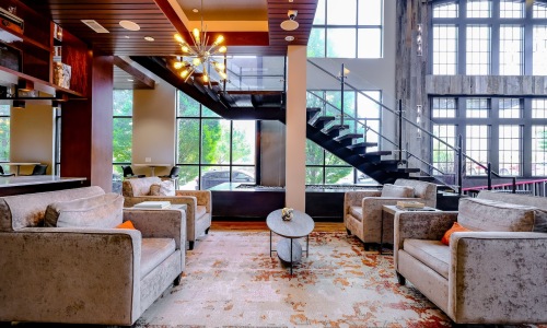 clubhouse with seating and stairwell