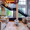 clubhouse with seating and stairwell