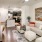 a living room with a large chandelier and a large white couch