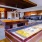 a room with a pool table and chairs