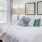 a bed with a white bed spread