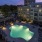 a pool in a courtyard between buildings