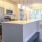 a kitchen with a marble island