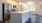 a kitchen with a marble island