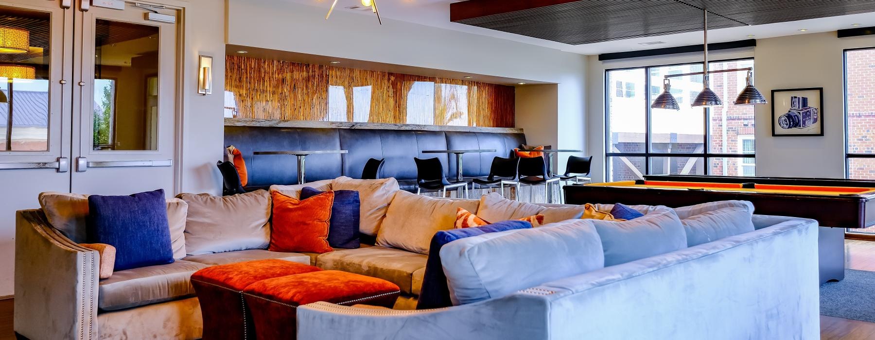 a living room with a large chandelier and a couch