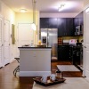 a kitchen with a table and chairs