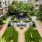 a courtyard with trees and buildings around it